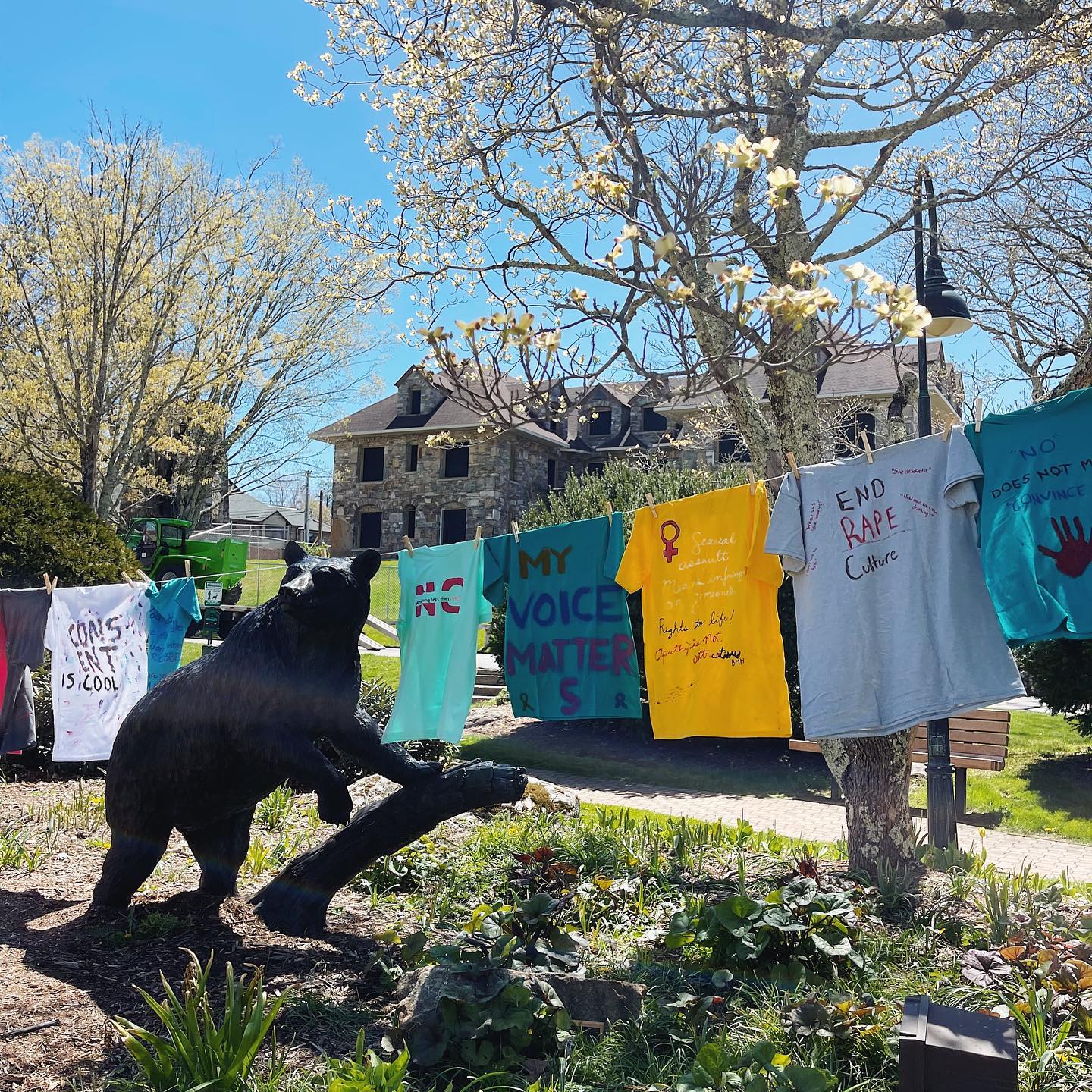 Custom shirts hanging on clothes line.