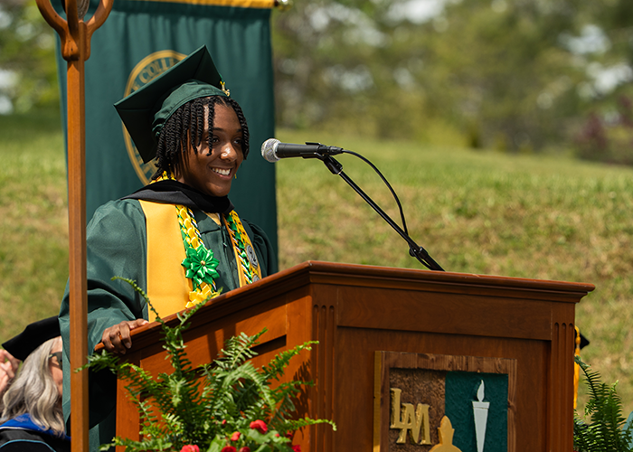 Sandra Mason stands at a podium.