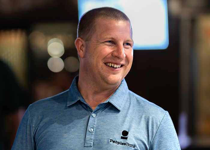 Headshot of Dan Robinson laughing.