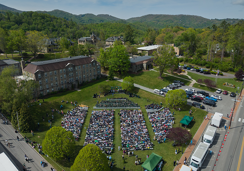 Aerial image of Commencement showing seats filled with graduates and guests.